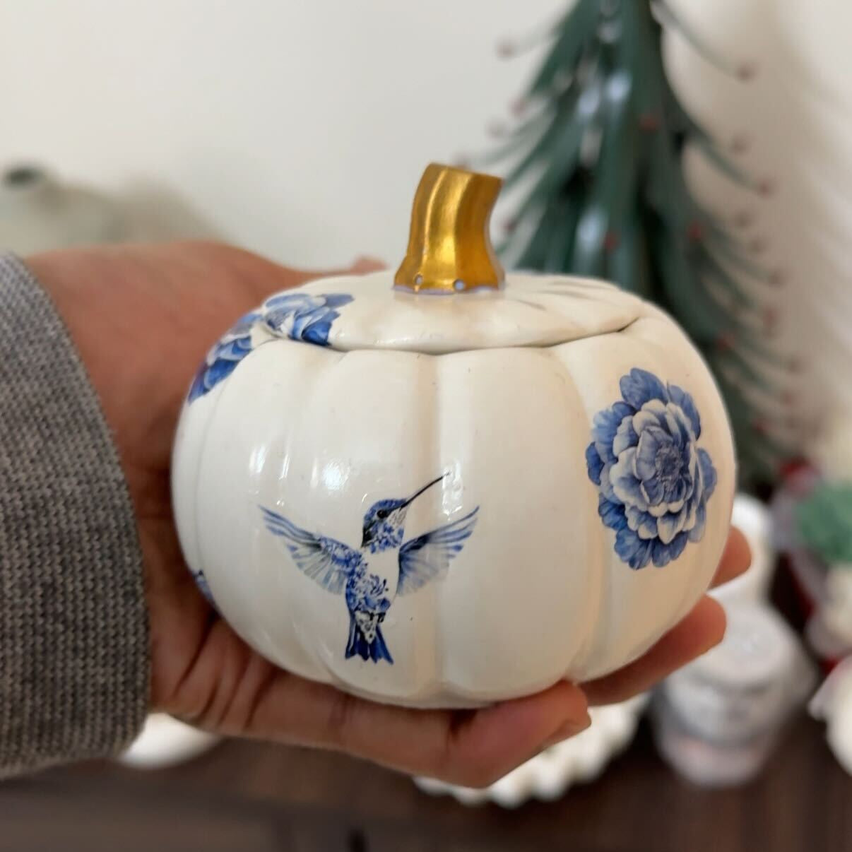 Vintage floral pumpkin candle jar close-up showing detailed pattern
